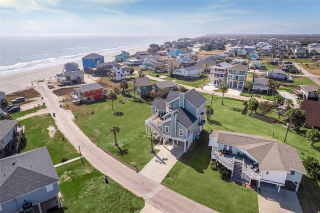 bird's eye view featuring a beach view and a water view