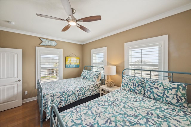 bedroom with ceiling fan, ornamental molding, and dark hardwood / wood-style flooring