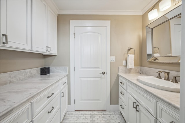 bathroom with tile patterned flooring, ornamental molding, and vanity