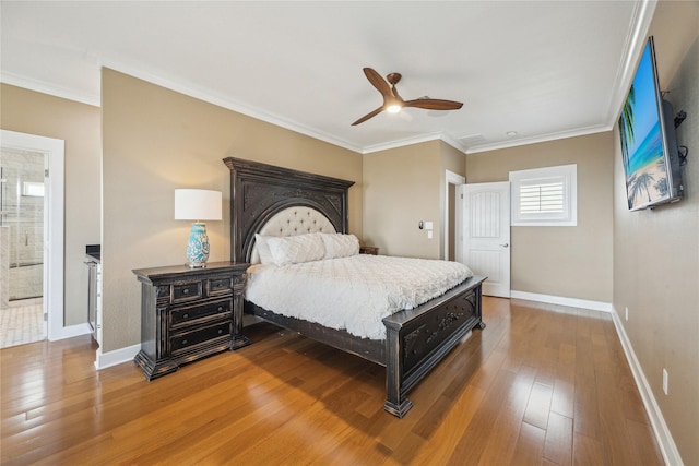 bedroom featuring wood-type flooring, ornamental molding, and ceiling fan