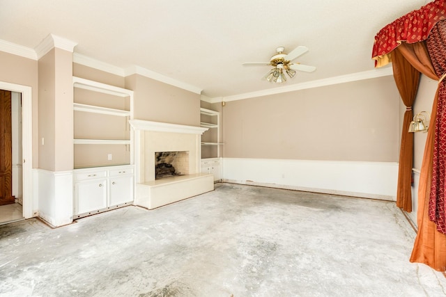 unfurnished living room featuring built in features, ornamental molding, and ceiling fan