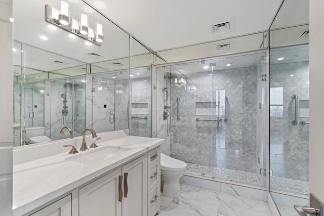 bathroom featuring vanity, an enclosed shower, and toilet