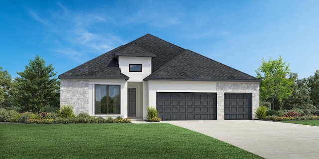 view of front of house featuring a garage and a front yard