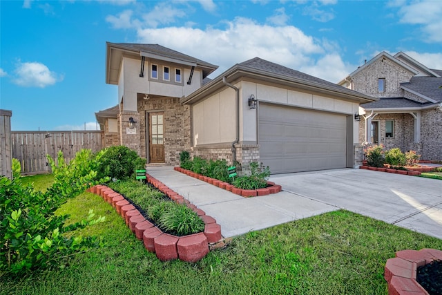 view of front of home with a garage and a front yard