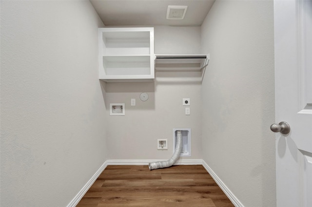 clothes washing area featuring hardwood / wood-style floors, washer hookup, hookup for an electric dryer, and hookup for a gas dryer