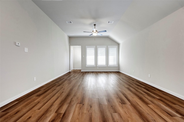 spare room featuring hardwood / wood-style flooring, ceiling fan, and lofted ceiling