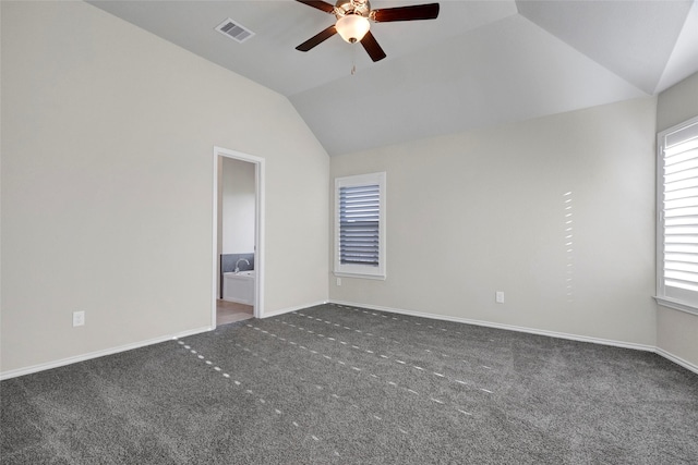 carpeted empty room featuring lofted ceiling and ceiling fan