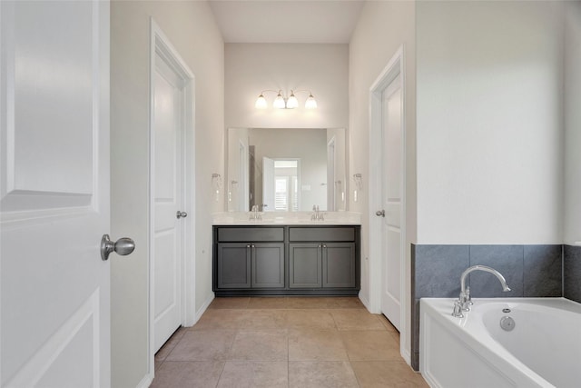 bathroom with vanity, a tub to relax in, and tile patterned floors