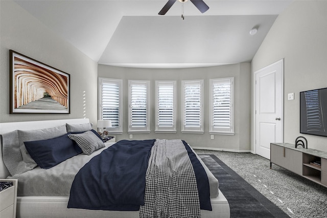 bedroom featuring lofted ceiling, carpet, and ceiling fan