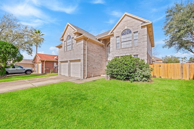 view of front of home with a garage and a front yard