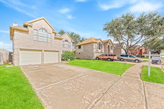 view of front facade with a garage and a front lawn