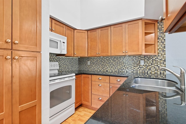 kitchen featuring brown cabinets, open shelves, tasteful backsplash, a sink, and white appliances