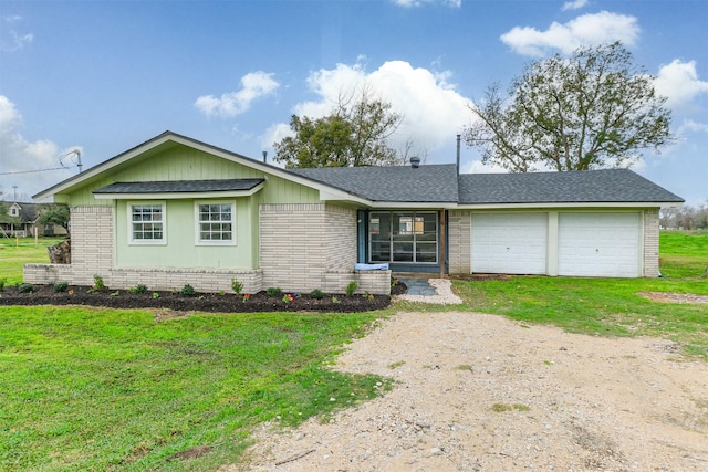 single story home with a garage and a front yard