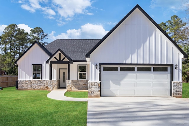 view of front of property featuring a garage and a front yard