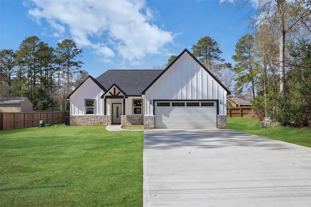 view of front of house with a garage and a front yard