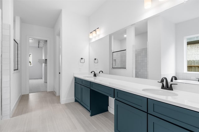 bathroom with vanity and walk in shower