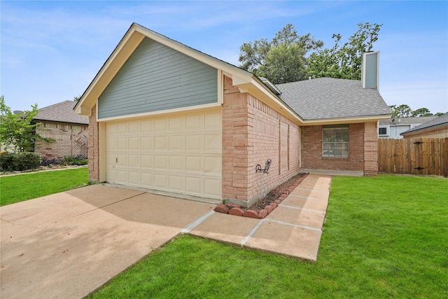 ranch-style house with a garage and a front lawn