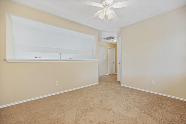 empty room with light colored carpet and ceiling fan