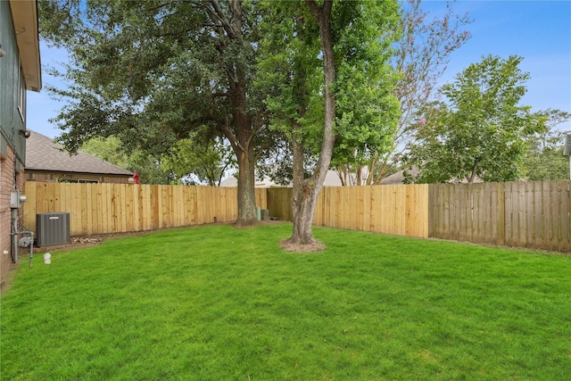 view of yard with central AC unit