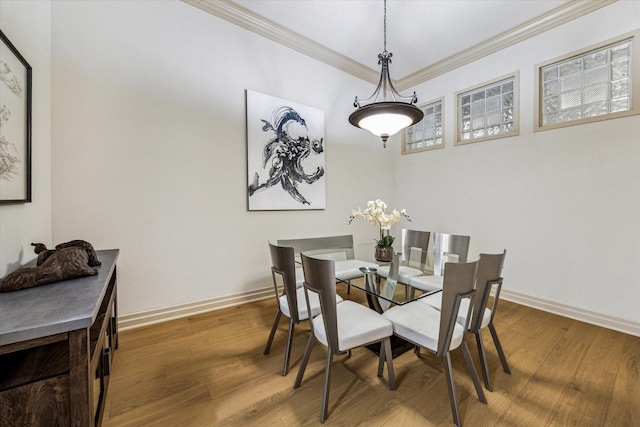 3388 Sage Rd Unit 2401, Houston, TX 77056 - dining space with crown molding, baseboards, and wood finished floors