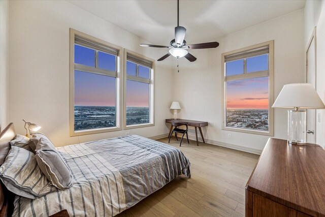 3388 Sage Rd Unit 2401, Houston, TX 77056 - bedroom featuring wood finished floors and baseboards