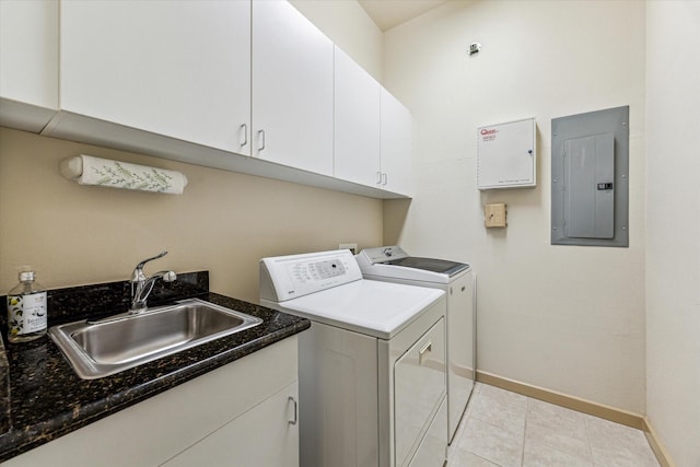 3388 Sage Rd Unit 2401, Houston, TX 77056 - clothes washing area with separate washer and dryer, electric panel, baseboards, cabinet space, and light tile patterned flooring