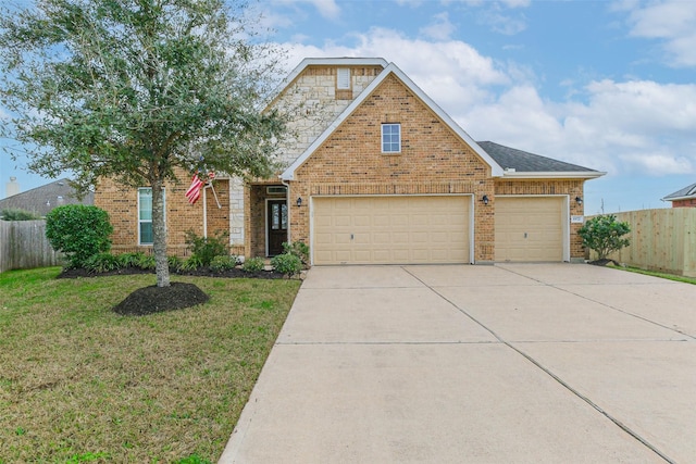 view of front of home with a garage and a front yard