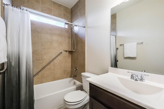 full bathroom featuring shower / tub combo with curtain, vanity, and toilet