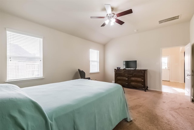 carpeted bedroom featuring vaulted ceiling and ceiling fan