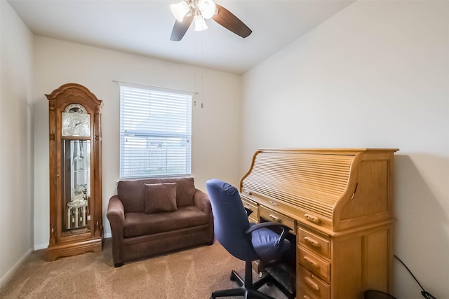 carpeted office featuring ceiling fan