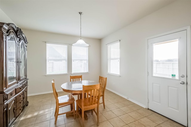 dining area featuring light tile patterned floors