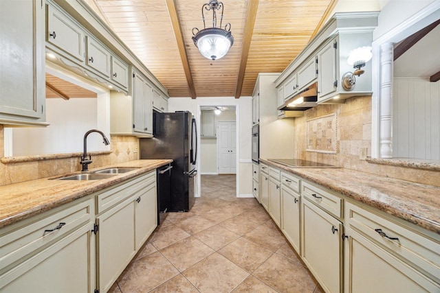 kitchen with sink, tasteful backsplash, light stone countertops, and black appliances