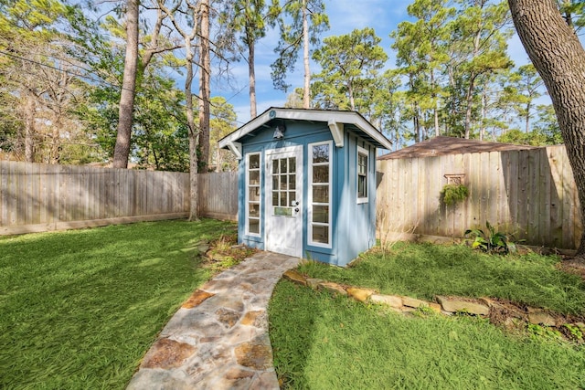 view of outdoor structure featuring a lawn