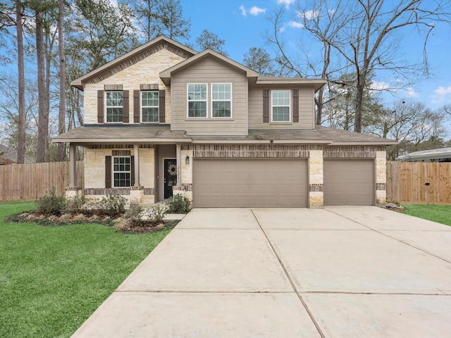 view of front facade with stone siding, fence, a front lawn, and concrete driveway