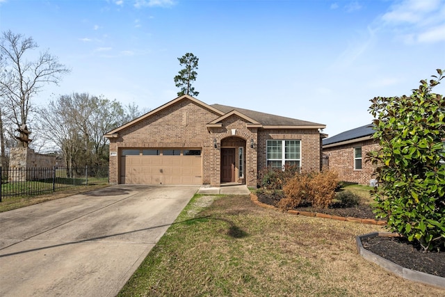 view of front of property with a garage and a front yard