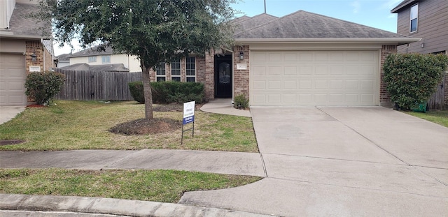 view of front facade featuring a garage and a front yard