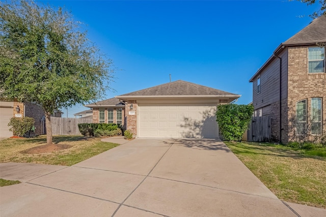 view of front facade featuring an attached garage, brick siding, fence, concrete driveway, and a front yard