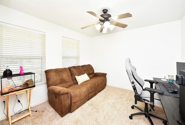 office with light carpet and ceiling fan