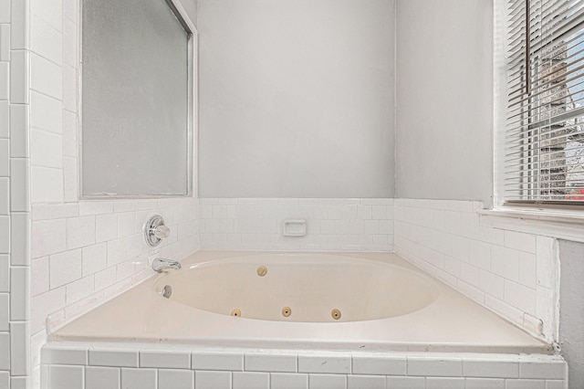 bathroom featuring tiled bath