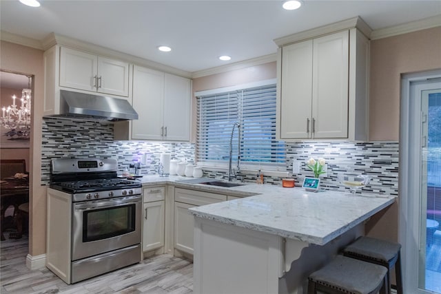 kitchen with white cabinetry, sink, crown molding, kitchen peninsula, and gas stove