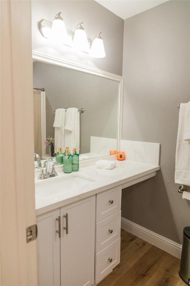 bathroom featuring vanity and hardwood / wood-style floors