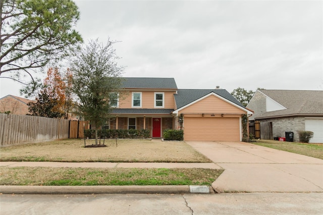 view of front facade with a garage and a front yard