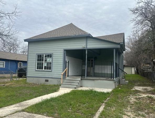 bungalow-style home with a porch and a front yard