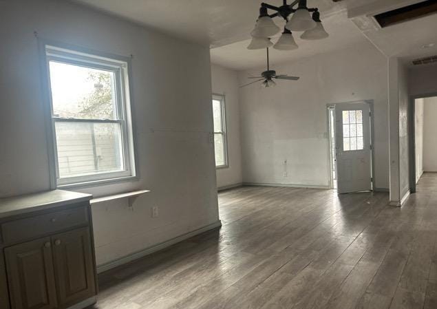 unfurnished room with hardwood / wood-style floors and ceiling fan