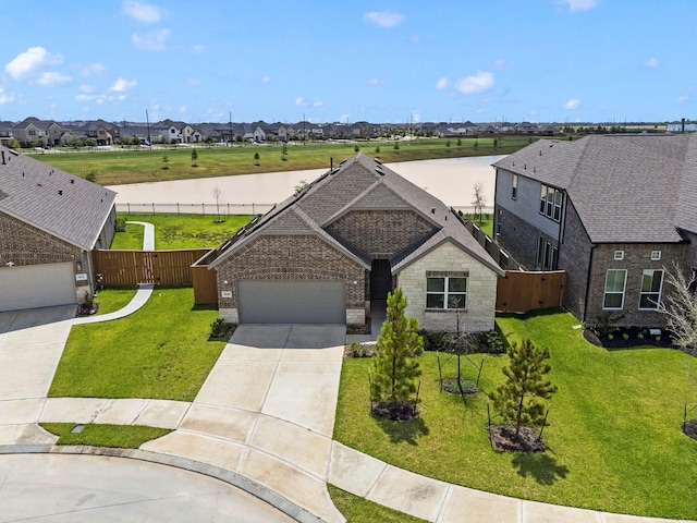 view of front of home with a garage and a front yard