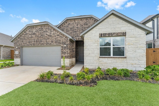 view of front of home featuring a garage and a front yard