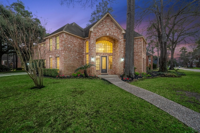 view of front of house with a yard