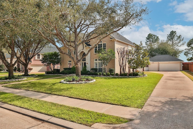 view of front of house with a garage, a front lawn, and concrete driveway