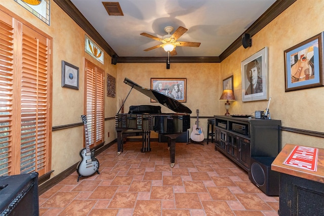 sitting room with baseboards, visible vents, crown molding, and stone finish flooring