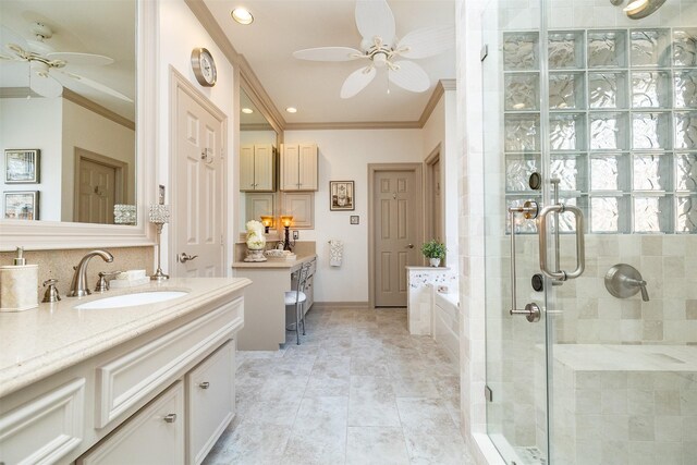 bathroom with ceiling fan, crown molding, vanity, a shower stall, and a bath